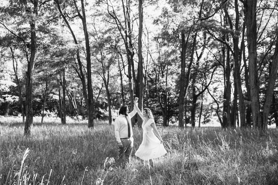 Finishing off their engagement session with a dance in the meadow