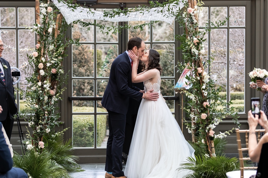 Sam and Jon sharing their first kiss as a newlywed couple